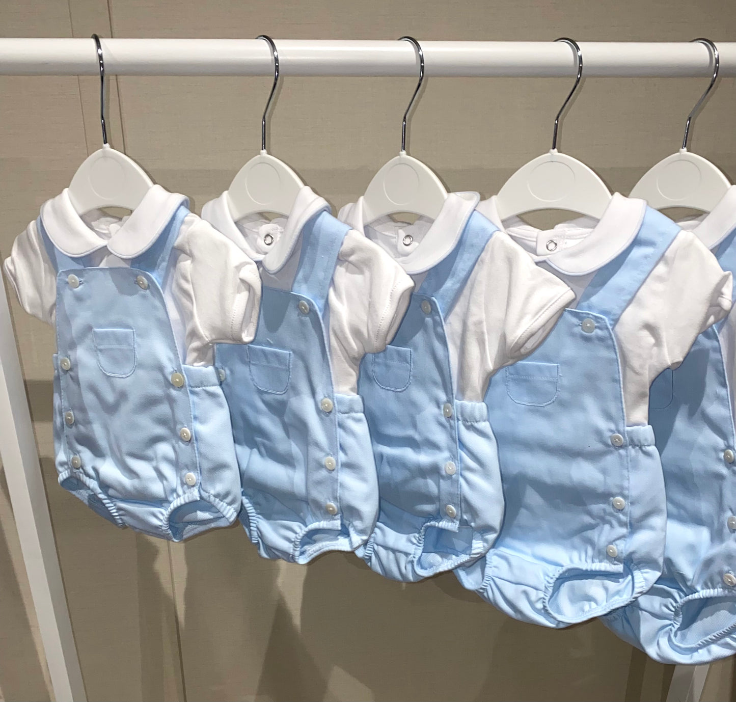 Boutique style baby romper with pocket detail