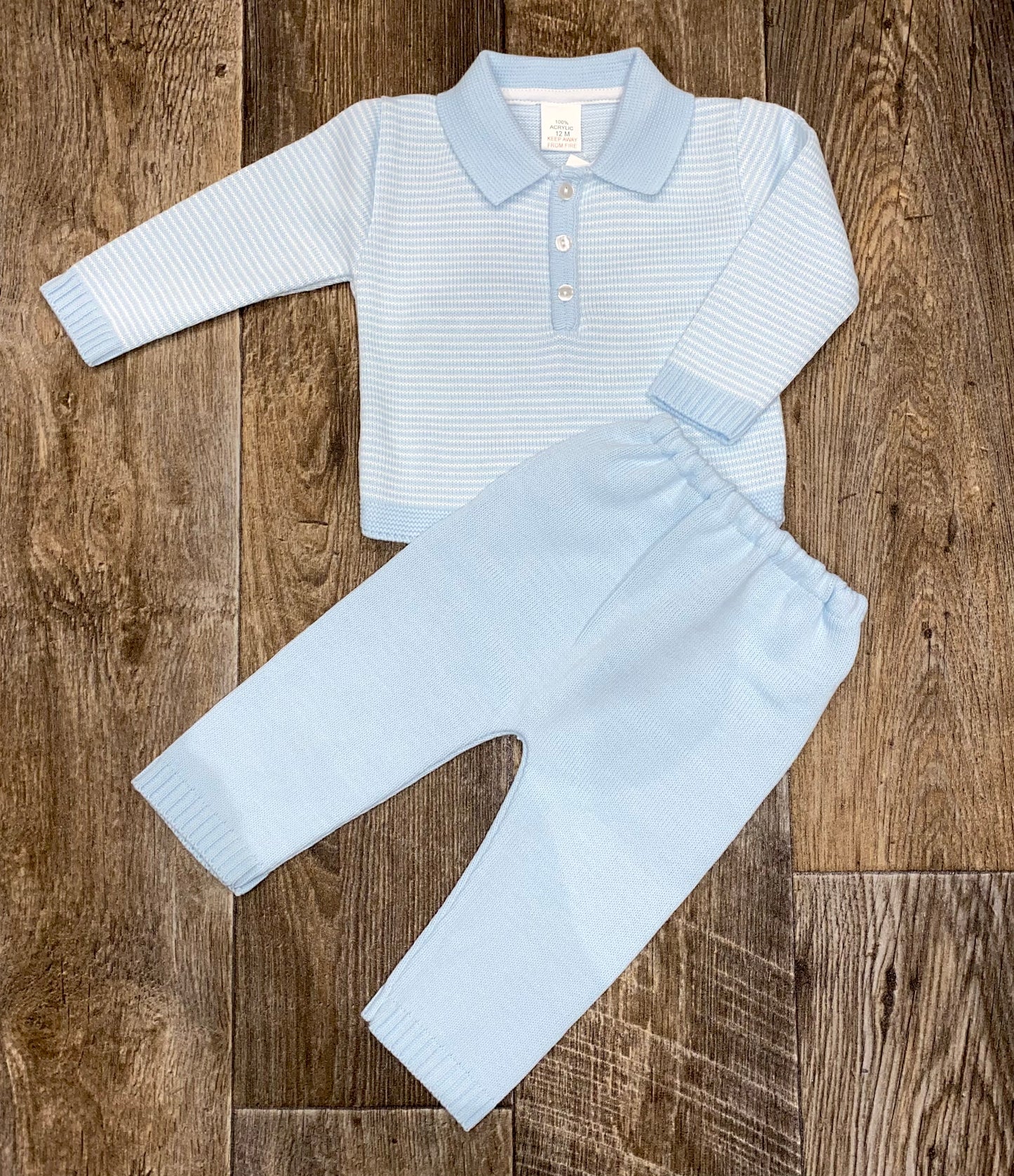 Boys blue knit two piece trouser set, with polo collar detail