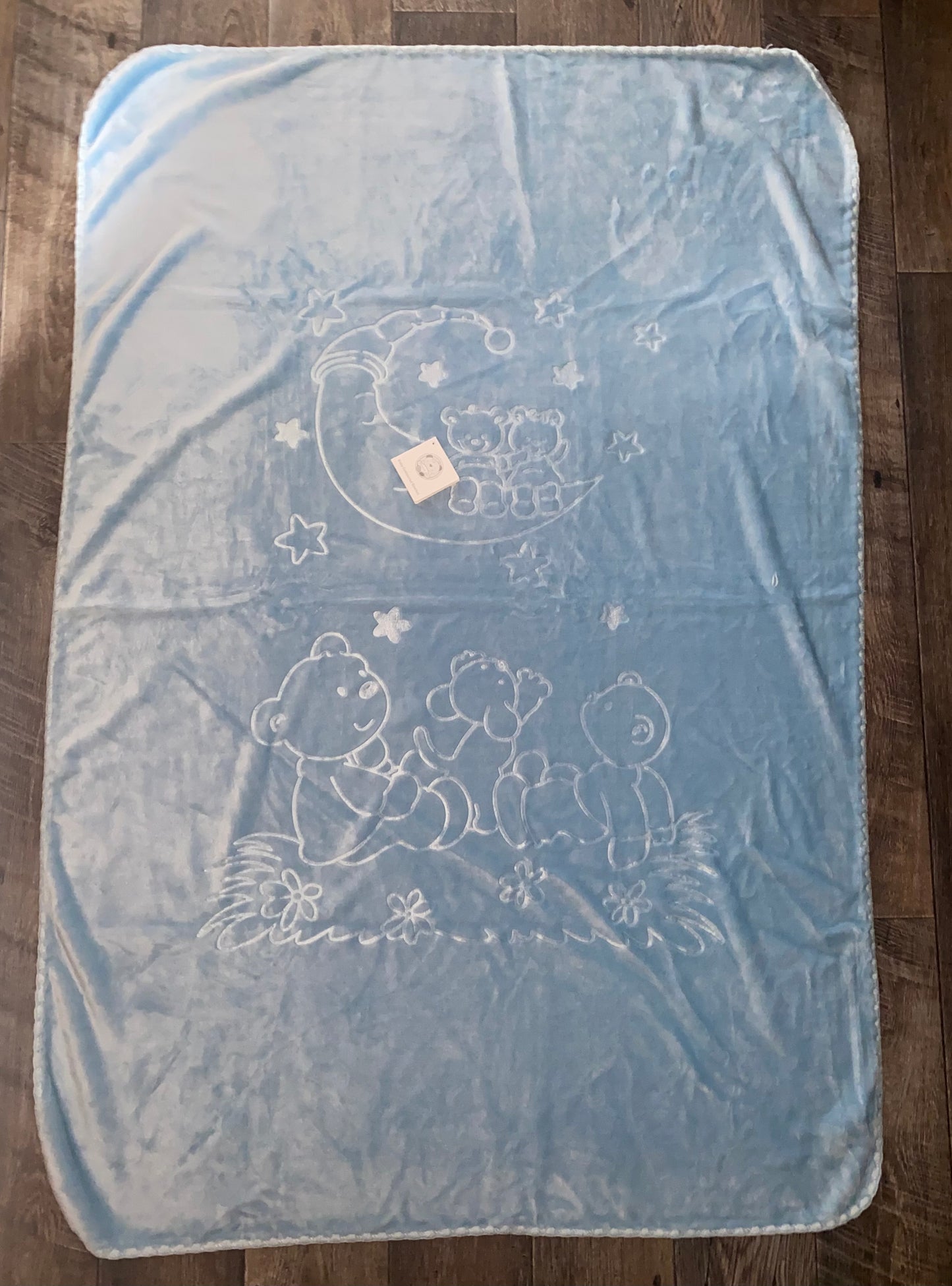 blue embossed spanish plush baby blanket with moon and teddy bear design