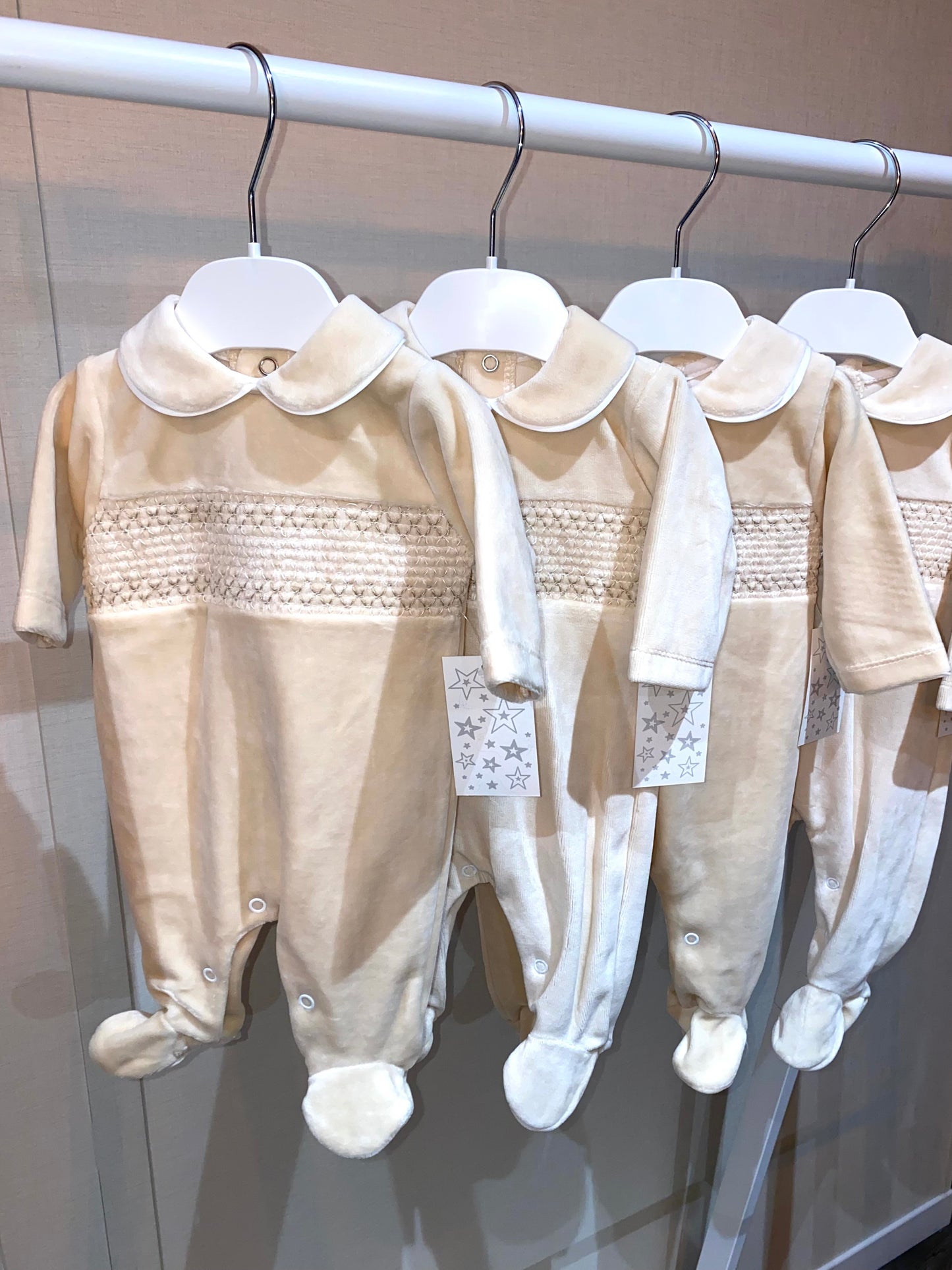 Traditional velour baby sleepsuit in beige colours