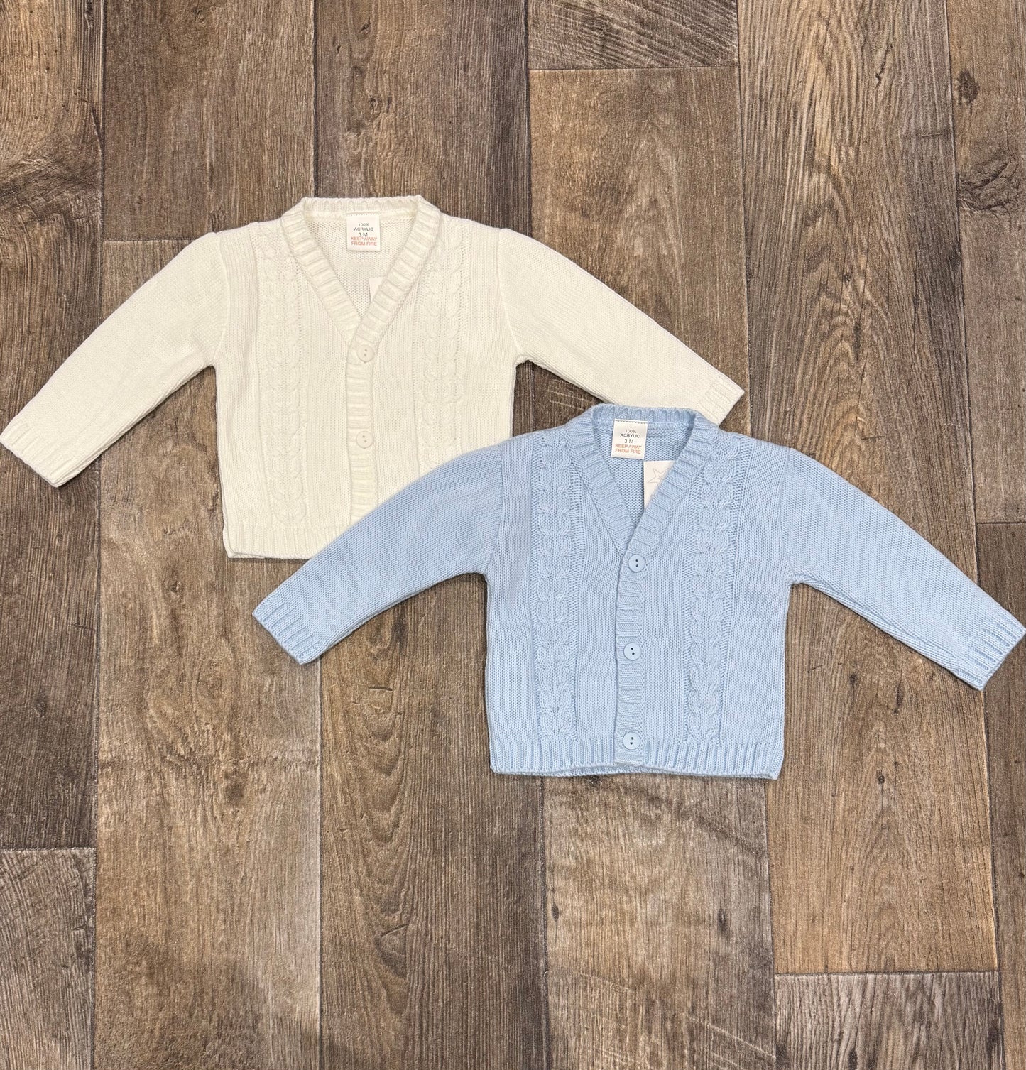 Cream and blue knitted baby cardigan with cable detail