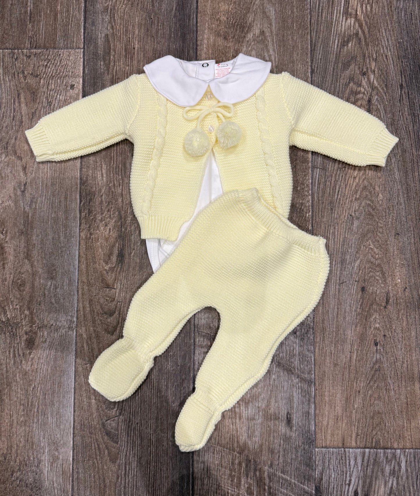 Lemon baby cardigan with pom pom ties