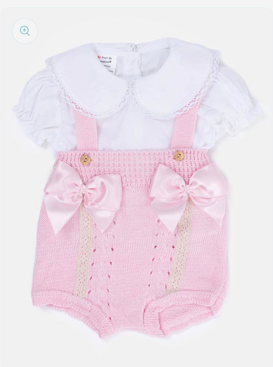 Pink knitted baby dungaree set with satin bows