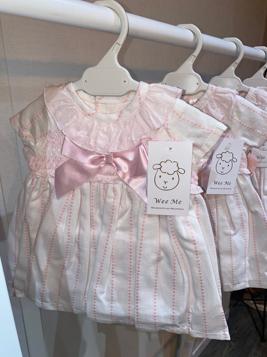 Blush and ivory striped baby occasion dress with satin bow from Wee Me