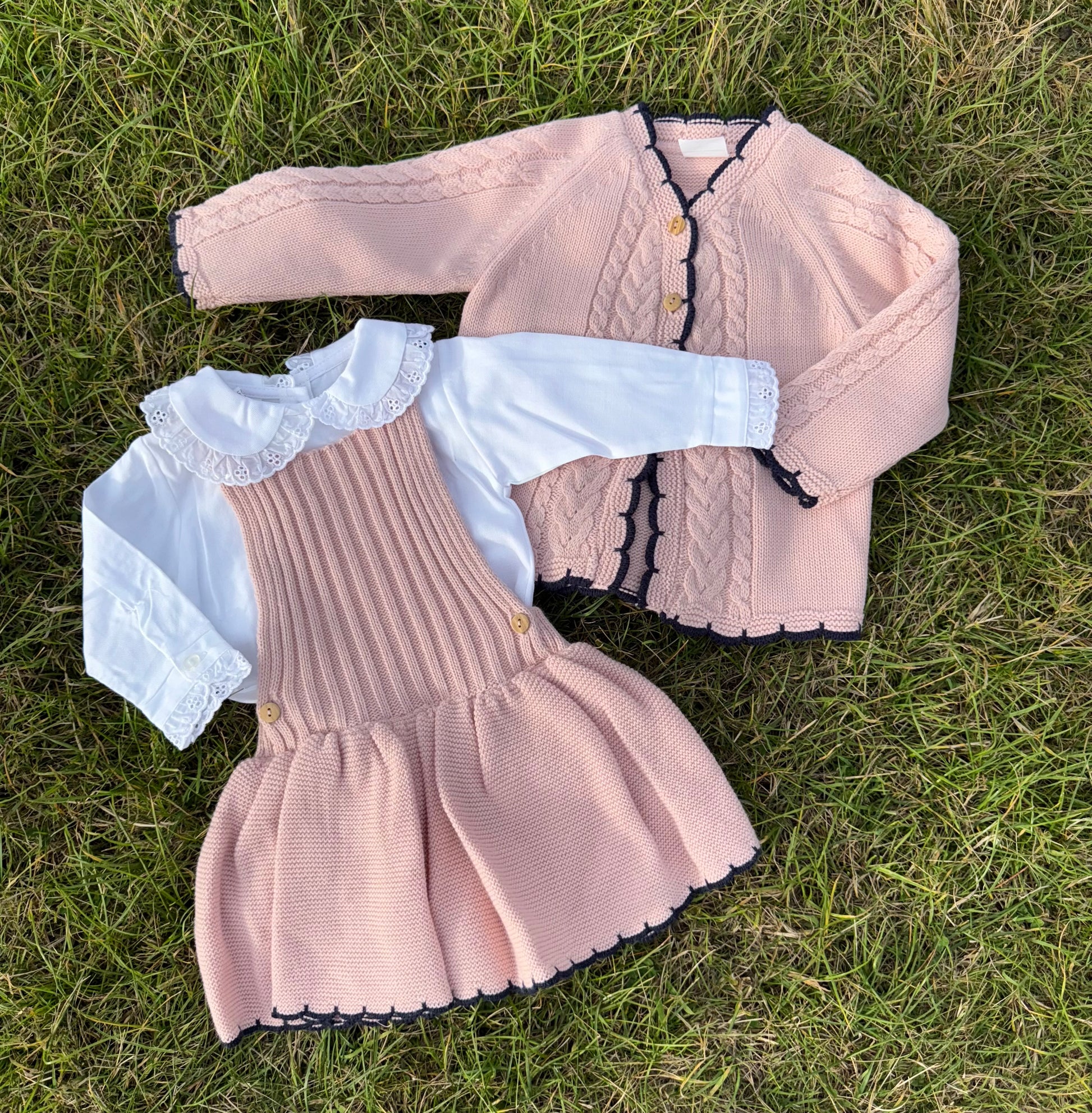 Pink knitted dress and cardigan set