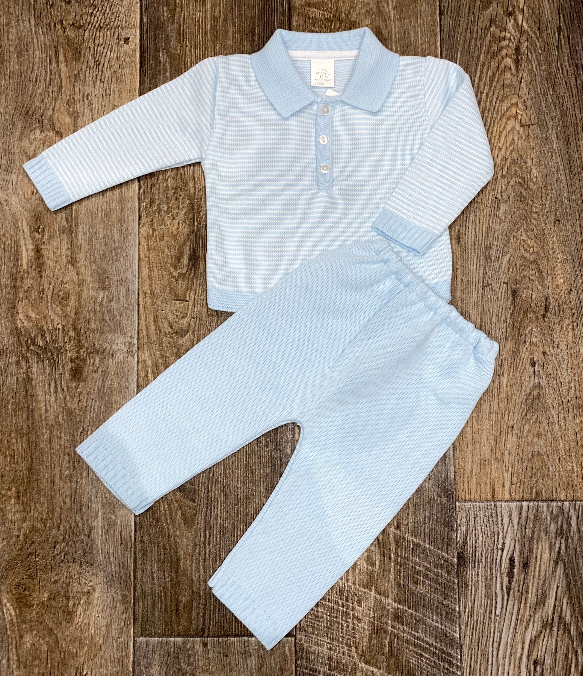Boys blue knit two piece trouser set, with polo collar detail