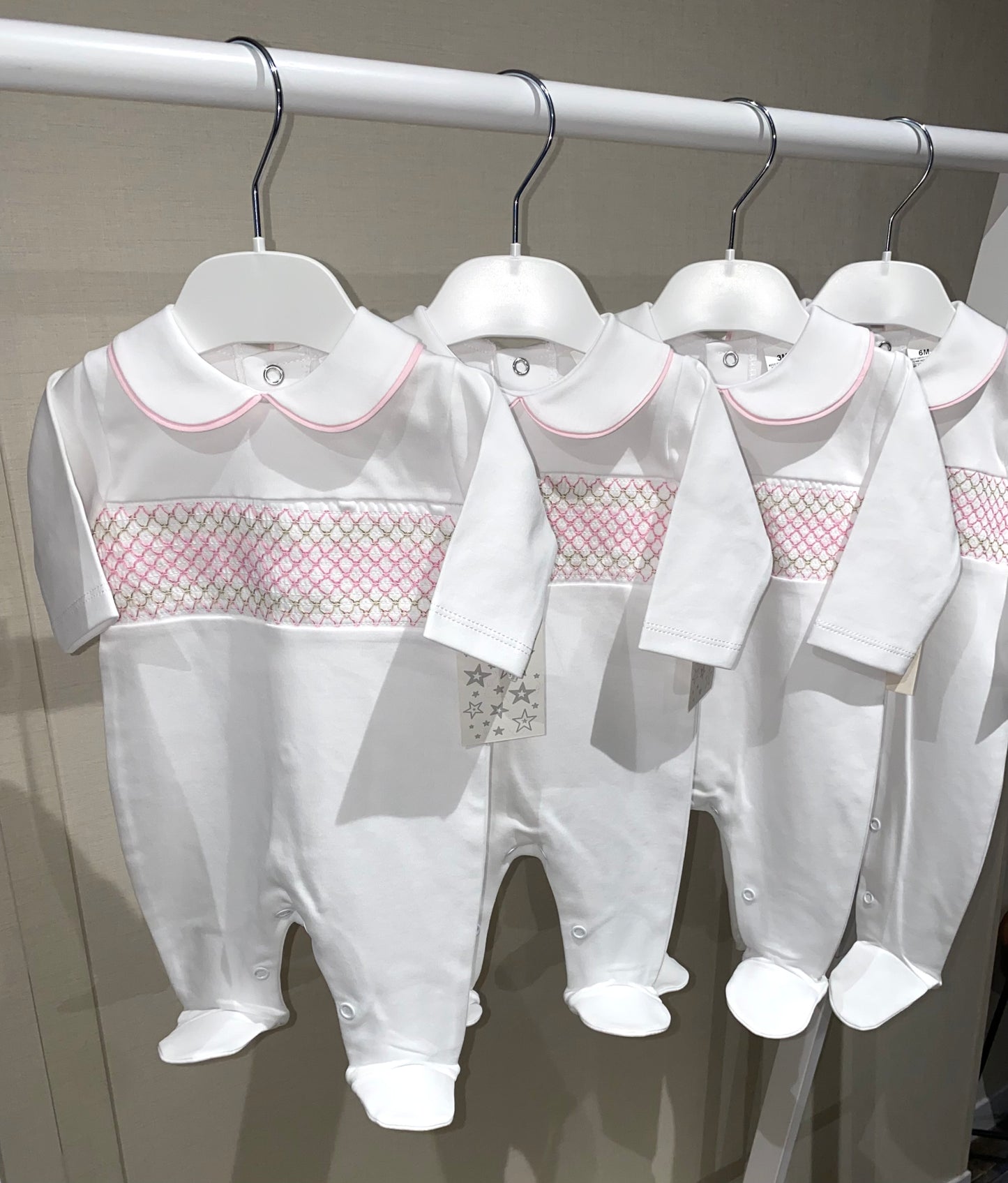 Traditional white and pink smock baby babygrow